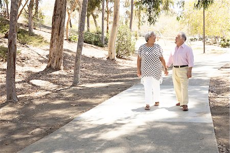 senior hispanic couple - Senior couple walking hand in hand, outdoors Stock Photo - Premium Royalty-Free, Code: 614-08308059