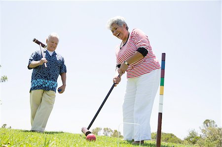 Senior couple playing croquet, outdoors Stock Photo - Premium Royalty-Free, Code: 614-08308053