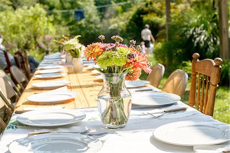 pictures of people flower gardens - Table setting for large family at tomato eating festival Stock Photo - Premium Royalty-Free, Code: 614-08308070