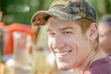 Man smiling at tomato eating festival Stock Photo - Premium Royalty-Free, Code: 614-08308073