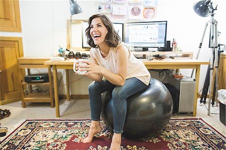 Woman Desk Exercise Ball Stock Photos Page 1 Masterfile