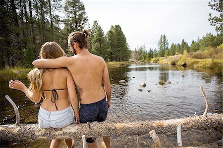 simsearch:649-07436560,k - Rear view of young couple sitting on fallen tree in river, Lake Tahoe, Nevada, USA Stock Photo - Premium Royalty-Free, Code: 614-08329427