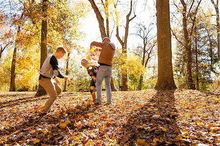 simsearch:614-06402622,k - Young woman playfighting with two teenage brothers in autumn forest Stock Photo - Premium Royalty-Free, Code: 614-08329535