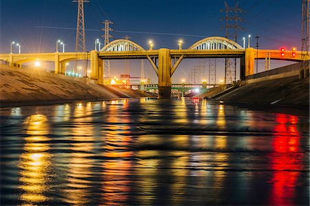 electric tower us - Diminishing perspective of Los Angeles river and 6th street bridge illuminated at night, Los Angeles, California, USA Stock Photo - Premium Royalty-Free, Code: 614-08329561