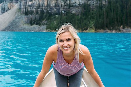 simsearch:700-06465432,k - Portrait of mid adult woman in canoe on Moraine lake, looking at camera smiling, Banff National Park, Alberta Canada Stock Photo - Premium Royalty-Free, Code: 614-08383507