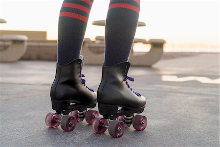 simsearch:614-08392542,k - Mid adult woman on rollerskates, rear view, low section Stock Photo - Premium Royalty-Free, Code: 614-08392541