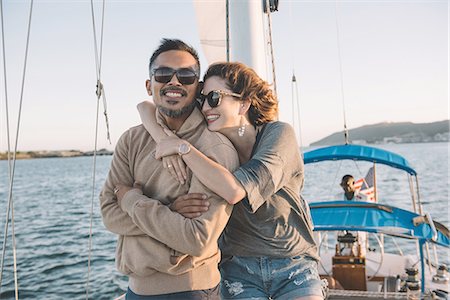simsearch:614-08392689,k - Couple enjoying view on sailboat, San Diego Bay, California, USA Stock Photo - Premium Royalty-Free, Code: 614-08392668