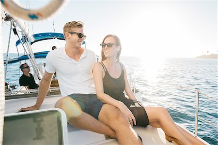 simsearch:614-08392689,k - Couple chatting on sailboat, San Diego Bay, California, USA Stock Photo - Premium Royalty-Free, Code: 614-08392676