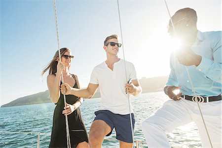 simsearch:614-08392689,k - Friends chatting on sailboat, San Diego Bay, California, USA Stock Photo - Premium Royalty-Free, Code: 614-08392687