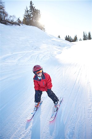 pictures of people skiing - Young skier going downhill Stock Photo - Premium Royalty-Free, Code: 614-08487766