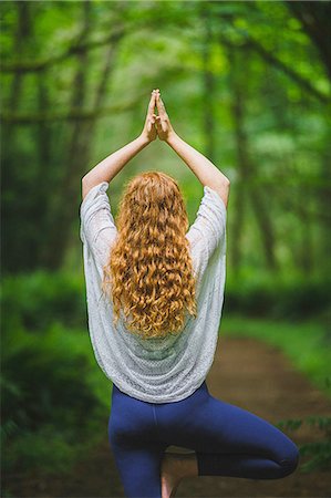 simsearch:614-08119768,k - Rear view of young woman in forest practicing yoga in tree pose Stock Photo - Premium Royalty-Free, Code: 614-08487972