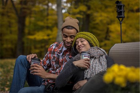 simsearch:649-09025831,k - Romantic mid adult couple drinking coffee at dusk in autumn garden Stock Photo - Premium Royalty-Free, Code: 614-08488031