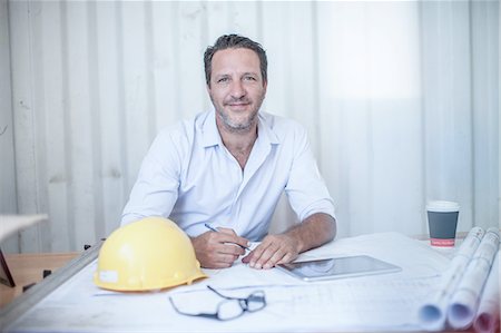 simsearch:614-06895837,k - Portrait of male construction foreman at desk in portable cabin Stock Photo - Premium Royalty-Free, Code: 614-08488052