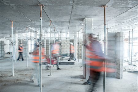 simsearch:614-00383197,k - Six blurred construction workers on the go in busy construction site Stock Photo - Premium Royalty-Free, Code: 614-08488089