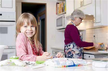 simsearch:614-08535822,k - Portrait of cute girl cooking with grandmother Stock Photo - Premium Royalty-Free, Code: 614-08535812