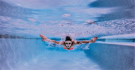 simsearch:614-08991181,k - Swimmer performing butterfly stroke Stock Photo - Premium Royalty-Free, Code: 614-08578260