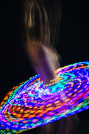 simsearch:614-08685097,k - Blurred image of nude dancer with light trails on waist Fotografie stock - Premium Royalty-Free, Codice: 614-08578296