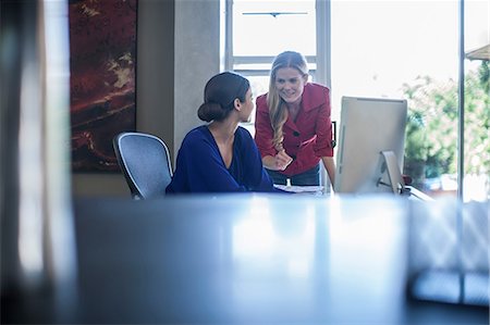 Two female designers working on computer in design office Stock Photo - Premium Royalty-Free, Code: 614-08578368