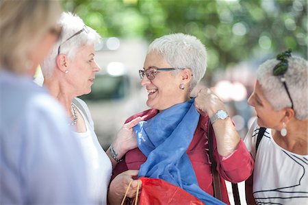 senior lady shopping - Senior woman and friends chatting in city Stock Photo - Premium Royalty-Free, Code: 614-08578374