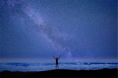 Person stretching arms in front of ocean, Death Valley, California, USA Stock Photo - Premium Royalty-Free, Code: 614-08578683