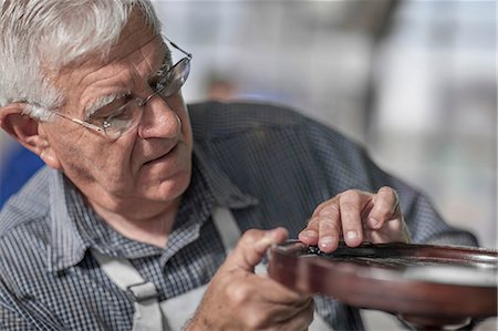 simsearch:649-07905311,k - Senior craftsman gluing table in antique restoration workshop Stock Photo - Premium Royalty-Free, Code: 614-08578782