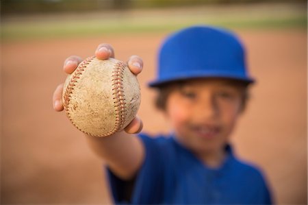simsearch:614-08578805,k - Blurred portrait of boy holding up ball at baseball practise Photographie de stock - Premium Libres de Droits, Code: 614-08578805