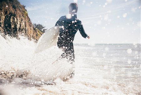 simsearch:614-05522909,k - Surfer running into sea, Santa Barbara, California, USA Fotografie stock - Premium Royalty-Free, Codice: 614-08641692