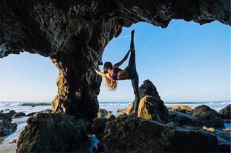 Young female ballet dancer poised on one leg in sea cave, Los Angeles, California, USA Stock Photo - Premium Royalty-Free, Code: 614-08641708