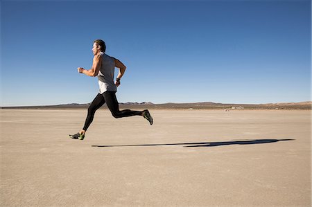 Man training, running on dry lake bed, El Mirage, California, USA Stockbilder - Premium RF Lizenzfrei, Bildnummer: 614-08641806