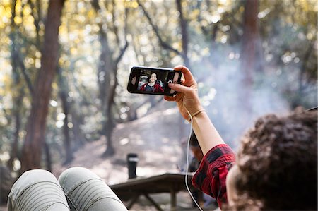 simsearch:614-08720980,k - Over shoulder view of young female hiker taking smartphone selfie in forest, Arcadia, California, USA Stock Photo - Premium Royalty-Free, Code: 614-08641889