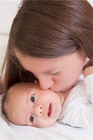 simsearch:614-07031695,k - Mother kissing baby boy on cheek Stock Photo - Premium Royalty-Free, Code: 614-08684715