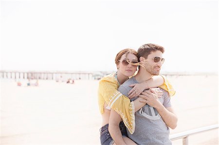 friendship travel adult - Couple by beach hugging, Coney island, Brooklyn, New York, USA Stock Photo - Premium Royalty-Free, Code: 614-08684882