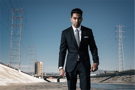 Businessman looking at camera, Los Angeles river, California, USA Stock Photo - Premium Royalty-Free, Code: 614-08684916