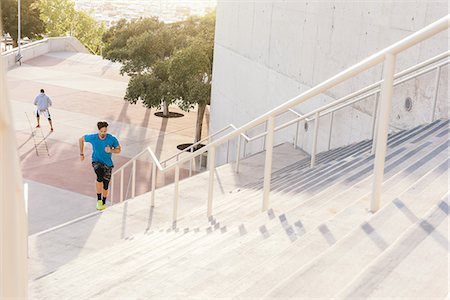 simsearch:614-08684939,k - Man training, running up stairway at sport facility, downtown San Diego, California, USA Stock Photo - Premium Royalty-Free, Code: 614-08684957