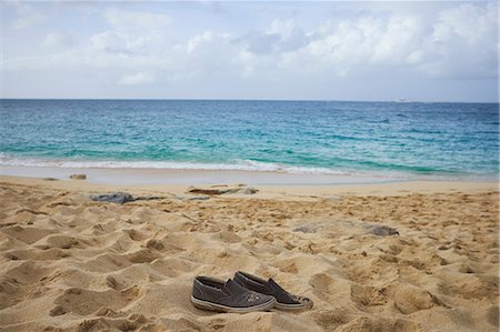 sandy beach - Pair of shoes on beach Stock Photo - Premium Royalty-Free, Code: 614-08726470