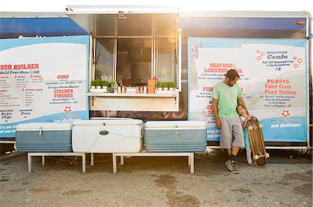 simsearch:614-08726534,k - Father and daughter standing beside fast food trailer, daughter holding skateboard Stock Photo - Premium Royalty-Free, Code: 614-08726524