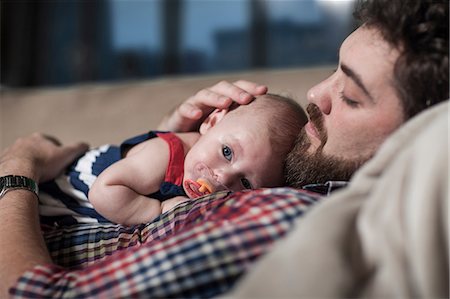 father comforting daughter - Father comforting baby girl at home Stock Photo - Premium Royalty-Free, Code: 614-08726582