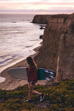 santa cruz surfer women - Surfer with surfboard on hill, Santa Cruz, California, USA Stock Photo - Premium Royalty-Free, Code: 614-08726784