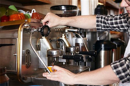 simsearch:649-06622991,k - Male worker in bakery, using coffee machine, close-up Stock Photo - Premium Royalty-Free, Code: 614-08720518