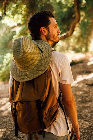 simsearch:614-08726640,k - Rear view of hiker with backpack and sunhat looking away, Malibu Canyon, California, USA Stock Photo - Premium Royalty-Free, Code: 614-08720894