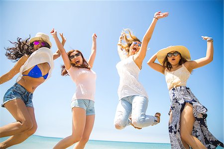 simsearch:649-08543983,k - Four adult female friends jumping mid air on beach, Malibu, California, USA Stock Photo - Premium Royalty-Free, Code: 614-08720954