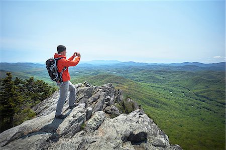 Male hiker taking smartphone photographs from ridge, Blue Ridge Mountains, North Carolina, USA Stock Photo - Premium Royalty-Free, Code: 614-08720980