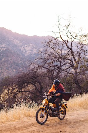 riding a bike funny pic - Man riding motorbike, wrapped in blanket, Sequoia National Park, California, USA Stock Photo - Premium Royalty-Free, Code: 614-08768436