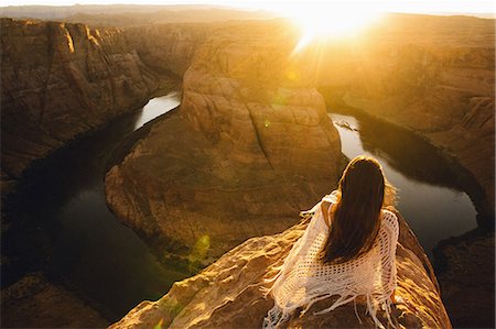 Woman relaxing and enjoying view, Horseshoe Bend, Page, Arizona, USA Stock Photo - Premium Royalty-Free, Code: 614-08826736