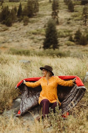 simsearch:614-09127206,k - Woman sitting in rural setting, wrapped in sleeping bag, Mineral King, Sequoia National Park, California, USA Stock Photo - Premium Royalty-Free, Code: 614-08826872
