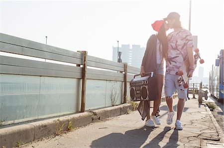 simsearch:695-05768224,k - Skateboarder couple kissing on street, Budapest, Hungary Stock Photo - Premium Royalty-Free, Code: 614-08826924