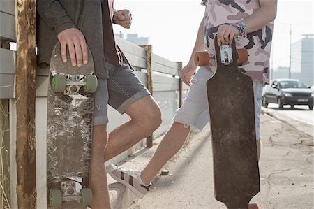 simsearch:695-05768224,k - Skateboarders standing and talking, Budapest, Hungary Stock Photo - Premium Royalty-Free, Code: 614-08826928