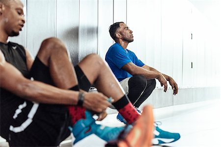 simsearch:614-08827243,k - Exhausted male basketball players taking a break on changing room floor Stock Photo - Premium Royalty-Free, Code: 614-08827241