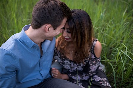 simsearch:649-08577651,k - Happy couple on grass field Stock Photo - Premium Royalty-Free, Code: 614-08821292