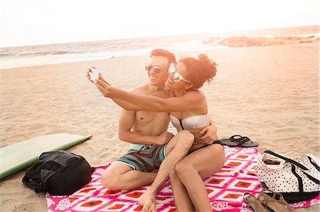 picnic blanket sunlight - Young couple taking smartphone selfie on Rockaway Beach, New York State, USA Stock Photo - Premium Royalty-Free, Code: 614-08821390